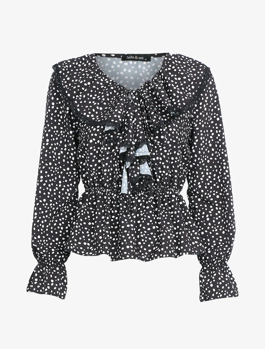 Blouse met stippenprint en jabot. - Zwart