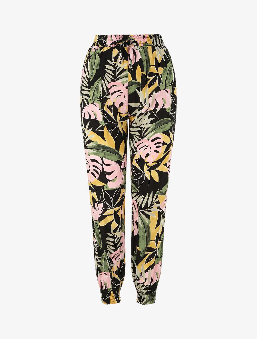 Vloeiende broek met tropische bloemenprint en elastische randen - Zwart